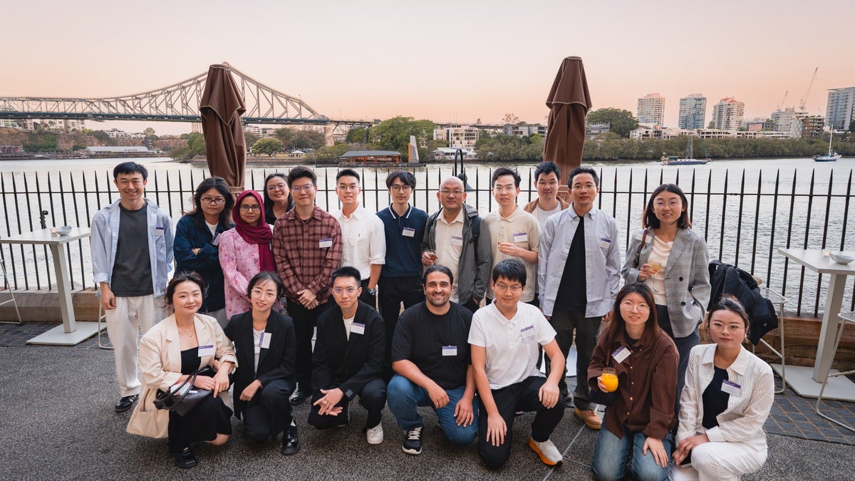 Current ACWEB students gather with the Story Bridge in the background